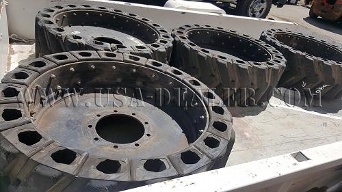 4 SKID STEER AIRBOSS TIRES AND RIMS - Los Angeles