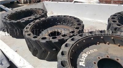 4 SKID STEER AIRBOSS TIRES AND RIMS