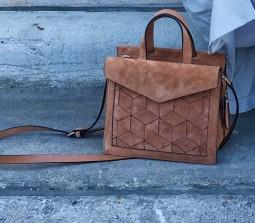 Missing brown suede handbag