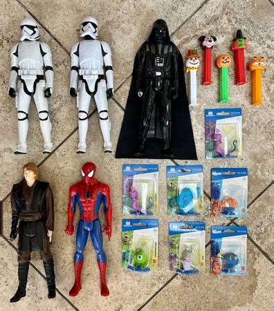 Various action figures, toys and Pez dispensers