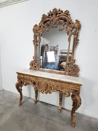 Carved French console and mirror look very nice